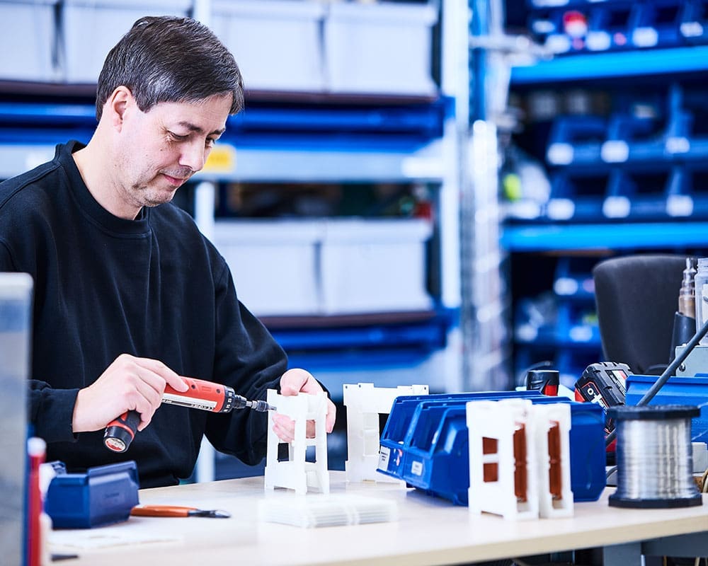 Vetaphone engineer at workbench